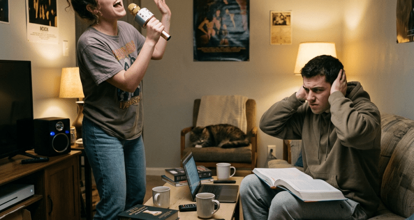 Person singing loudly, annoyed roommate nearby
